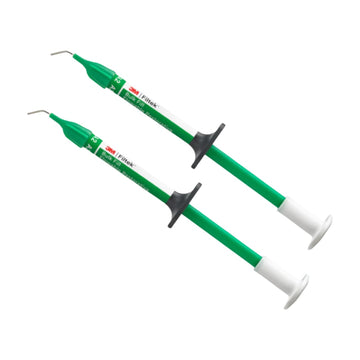 Two dental instruments with green handles and white tips on a white background