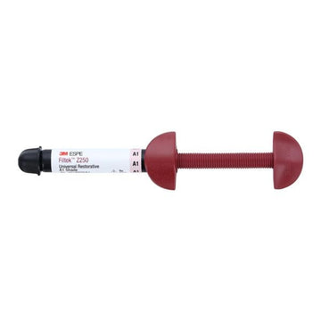 Red dental instrument with 3M ESPE label on a white background